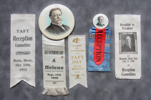 A group of ribbons and buttons are displayed.