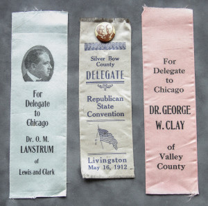 Three ribbons with political slogans on them.