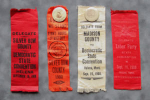 A group of four ribbons that are on top of each other.