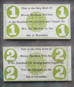 Two identical paper money with the numbers 1 and 2 on them.