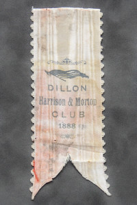 A ribbon with the name of dillon, harrison & morrow club printed on it.