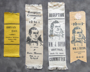 A group of four ribbons with various images on them.