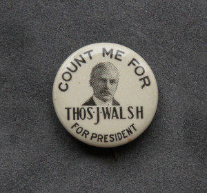 A button with a picture of thos j walsh on it.