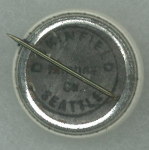 A needle in the center of a button.