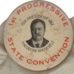 A button with an image of theodore roosevelt on it.