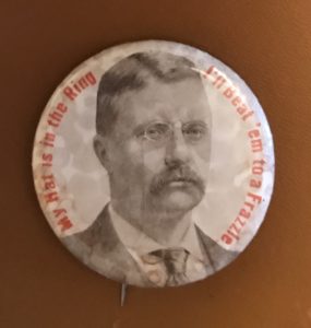 A button with an image of theodore roosevelt.