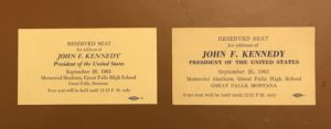 A pair of business cards with the names of presidents.