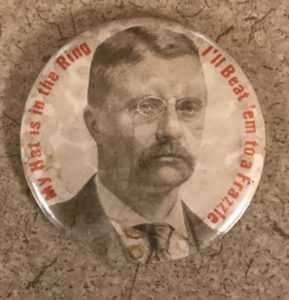 A button with an image of theodore roosevelt.